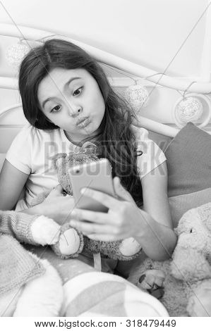 Happy Childhood. Girl With Smartphone Use Modern Technology. Selfie With Favorite Toy. Send Selfie P