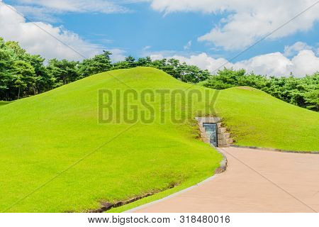Gongju, South Korea; July 29, 2019: Concrete Walkway Leading To Entry Of Songsan-ri Tombs At First D
