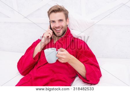 Hipster Guy Pajamas Bathrobe Freelance Worker Relaxing At Home. Remote Work Concept. Glad To Hear. M