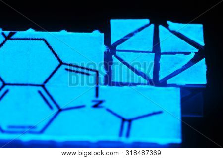 pieces of paper with chemical structures, micro dosing concept