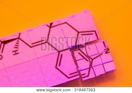 pieces of paper with chemical structures, micro dosing concept