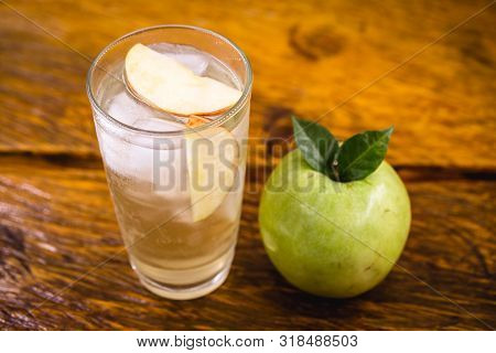 Apple Spritzer (apfelschorle) Pitcher, Glass Pitcher Of Homemade Spritzer Served With Crushed Ice An