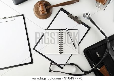 Medical Law Concept.  Gavel And Stethoscope On The Wihte Table.