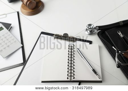 Medical Law Concept.  Gavel And Stethoscope On The Wihte Table.