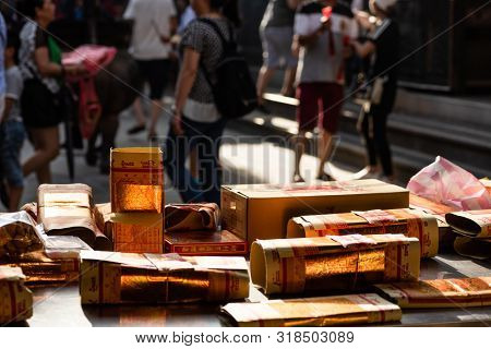 Yunlin, Taiwan - July 13th, 2019: chinese joss gold paper craft on a table at Beigang Chaotian Temple, Yunlin, Taiwan, Asia