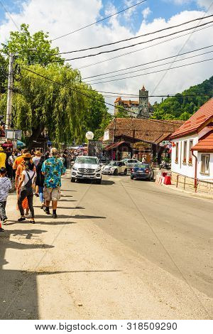 Bran, Romania – 2019. People On Their Way To Bran Castle (castelul Bran). Legendary Historical Castl