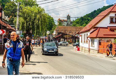 Bran, Romania – 2019. People On Their Way To Bran Castle (castelul Bran). Legendary Historical Castl