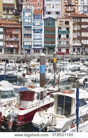 Colorful Harbor With Boats And Traditional Buildings Bermeo. Euskadi, Spain
