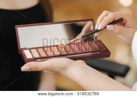 Makeup Artist Hold A Pelette And Put Brush For Work