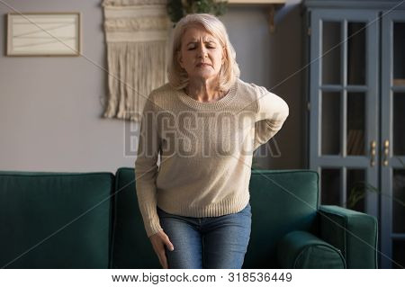Upset Old Woman Touching Sore Spine Feel Sudden Back Pain