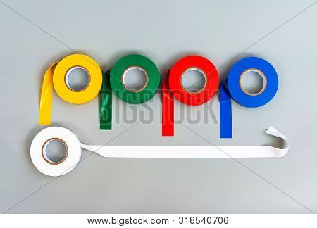 Rubber Insulating Tape Of Different Colors On A Gray Background