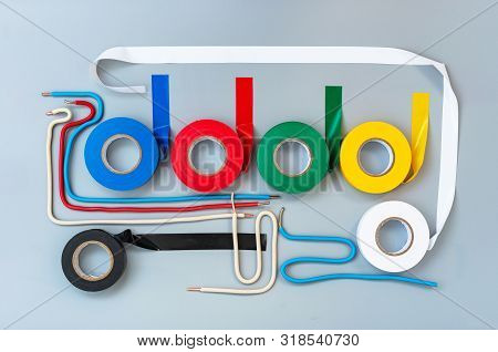 Rubber Insulating Tape Of Different Colors And Samples Of Single-core Wires On A Gray Background
