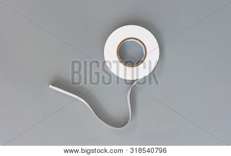 Rubber Insulator White On A Gray Background
