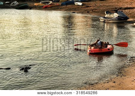 Tabarca Island, Alicante, Spain- July 15, 2018: Tourist Lying In Inflatable Boat On The Beach Of Tab