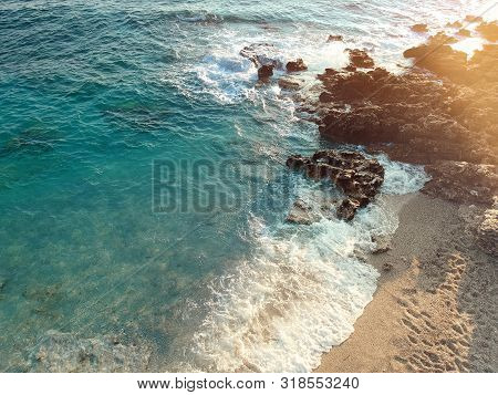 Aerial View Rocky Beach And Crystal Turquoise Water Of Ionian Sea In Albania. Calm And Relaxing View