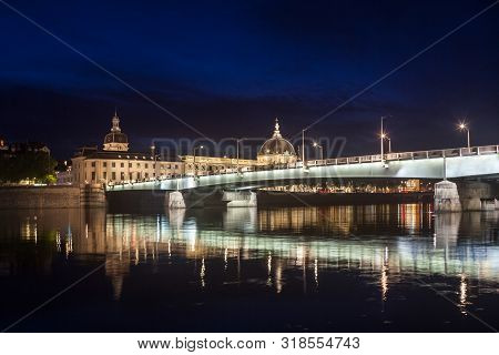 Pont De La Guillotiere Bridge In Lyon, France Over A Panorama Of The Riverbank Of The Rhone River (q
