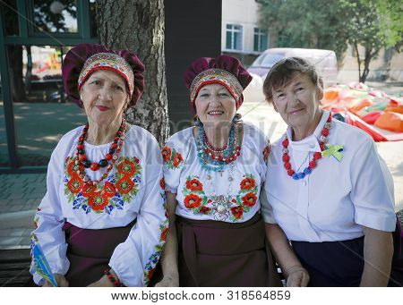 Ukraine, Pokrov - August 23, 2019: National Flag Day Celebration. Three Elderly Females Friends Dres
