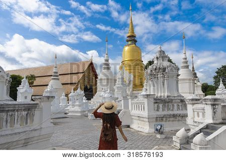 A Woman Tourist Is Enjoy Sightseeing Inside Wat Suan Dok In Chiangmai, Thailand.