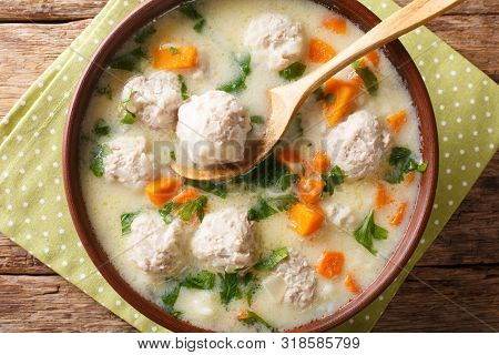 Traditional Soup With Meatballs, Yogurt And Vegetables Close-up In A Bowl. Horizontal Top View