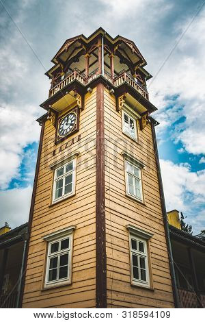 Iwonicz Zdroj, Poland - 13.08.2019: Old Town In Poland Iwonicz Zdroj. View At Old Wooden Clock Tower