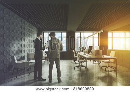 Two Businessmen In Gray Office With Lounge