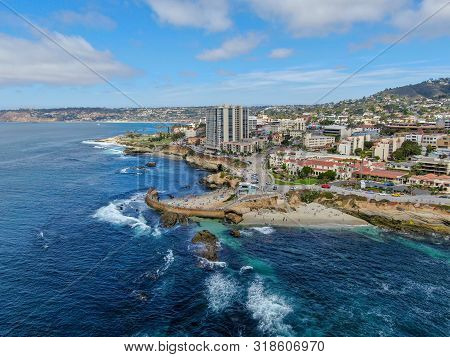 Beachgoers Enjoying A Beautiful Sunny Afternoon At La Jolla Cove In San Diego, Ca. Usa. Famous Touri