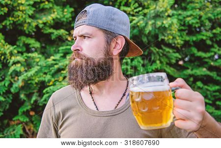 Drinking Culture. Hipster Holding Beer Mug. Bearded Hipster Drinking Beer On Summer Nature. Hipster 