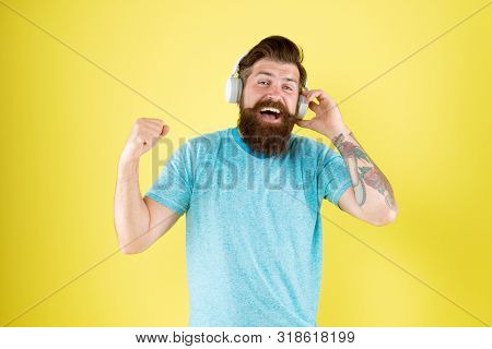 Bearded Man Listen Music Wireless Gadget. Hipster Happy Using Modern Wireless Headphones. Freedom Go