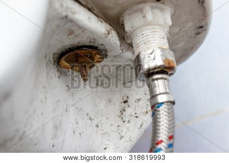 Water Supply Fitting Of Cistern Tank Of The Toilet Bowl At Water Closet Close Up