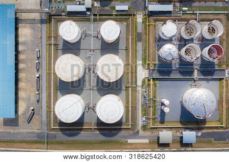 Aerial View Of Chemical Industry Storage Tank And Tanker Truck In Wailting In Industrial Plant To Tr