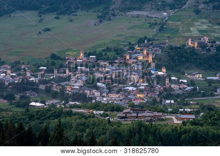 Night View On Mestia With Its Beautiful Illuminated Svan Towers And High Mountains. Svaneti, Georgia