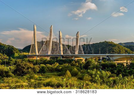 Aramchangyo Bridge Designed By Sk E&c Near Sejong City In South Korea Under Blue Partly Cloudy Sky.