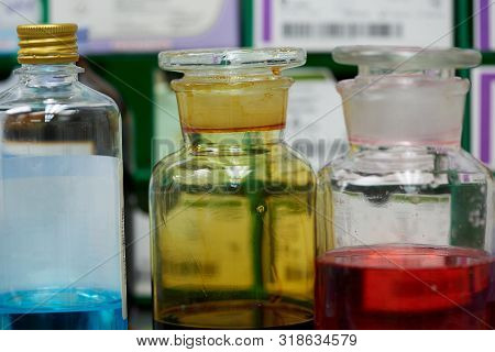Antiseptics In Glass Bottle On The Shelf In Operating Room.