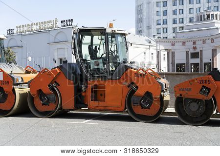 Russia, Moscow, 2019-08-10. The Road Roller Is On The Road. Preparation For Repair Of The Roadway. T