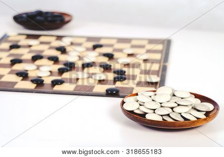 Board Game Go And Black And White Bones. Go Or Wei-chi ,asian Board Game.
