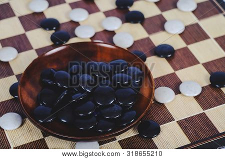 Board Game Go And Black And White Bones. Go Or Wei-chi ,asian Board Game.