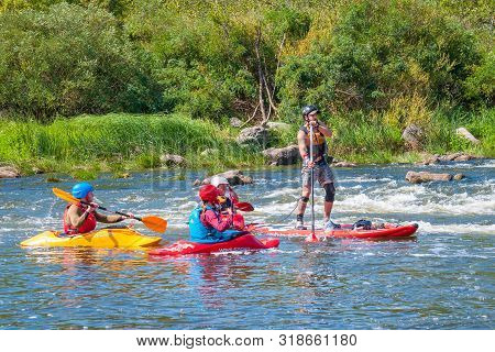 Myhiya, Ukraine - August 17, 2019: Athletes Kayakers During Training On Whitewater. Man On Inflatabl