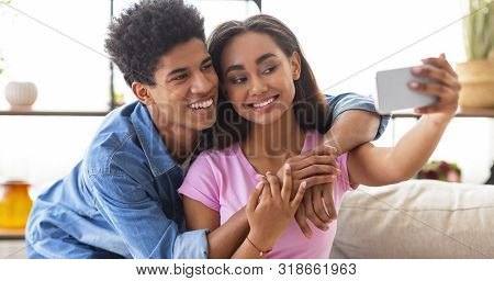 Capturing Happy Moments. Closeup Of Joyful Young Couple Making Selfie On Smartphone Camera While Hav