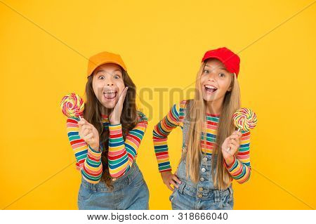 Sugar Free Treats. Happy Childrens Day. Holiday Celebration. Happy Girls Hold Lollipop Candy. Join C