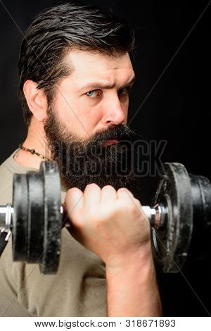 Bearded Man With Dumbbell During An Exercise. Muscular Fitness Model Working Out With Dumbbell. Fitn