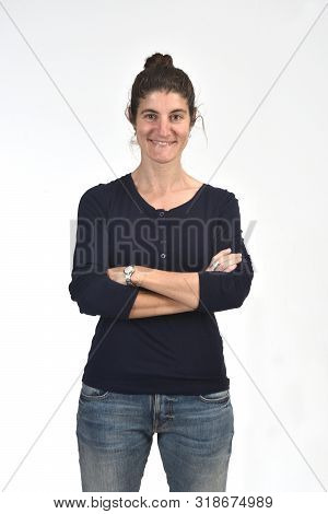 Woman With Arms Crossed On White Background, Smiling