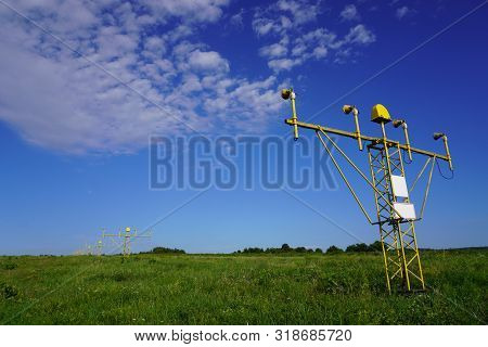 Yellow Metal Support Systems Of Care During Takeoff And Landing - Landing Direction Light Near Runwa