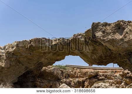 Natural Bridge Of Lovers Cape Greko, Cyprus, Near Ayia Napa At Sunset. Bridge Of Lovers Cyprus.