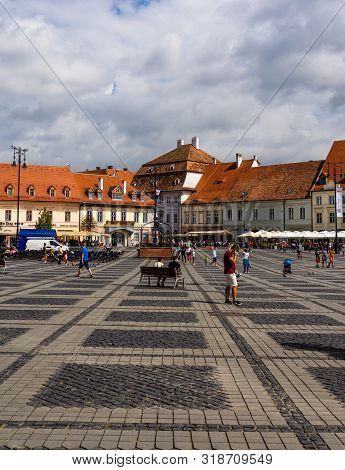 Sibiu, Romania - 2019. Tourists Wandering In The Big Square Of Sibiu (piata Mare).