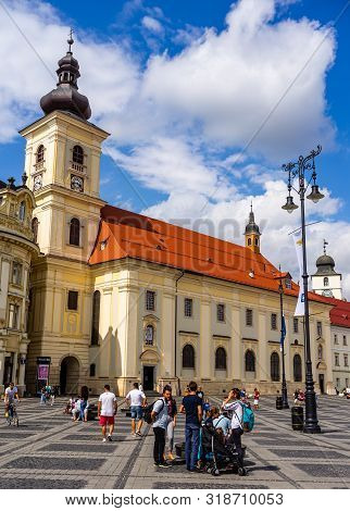 Sibiu, Romania - 2019. Tourists Wandering In The Big Square Of Sibiu (piata Mare).