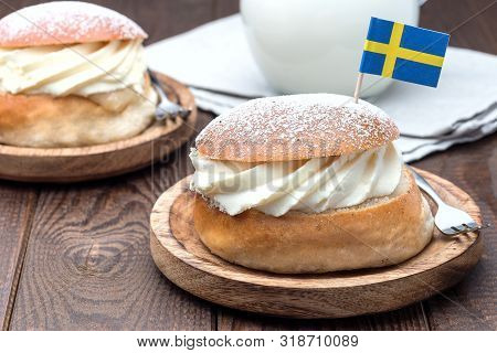 Traditional Swedish Dessert Semla, Also Called Shrove Bun, With Almond Paste And Whipped Cream Filli