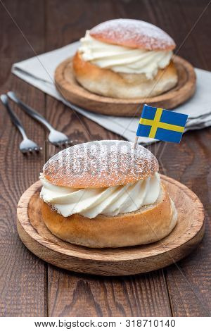 Traditional Swedish Dessert Semla, Also Called Shrove Bun, With Almond Paste And Whipped Cream Filli