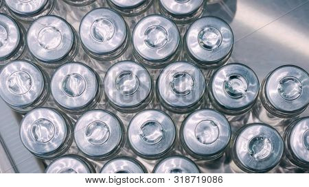 Top View - Pharmaceutical Automatic Production Line - Conveyor Belt With Empty Glass Bottles At Phar