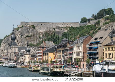 Dinant, Belgium - June 26, 2019: Citadelle Fortification Seen From Right South Bank Of Meuse River W