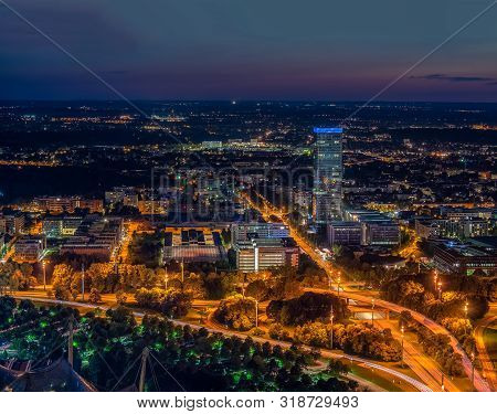 Offices Illuminated In The Night Light Of Munich.